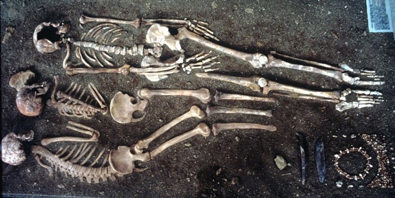 Triple Paleolithic burial dating to 25,000 years ago, comprising the skeletons of an adult Homo sapiens and two youths in the Balzi Rossi Caves